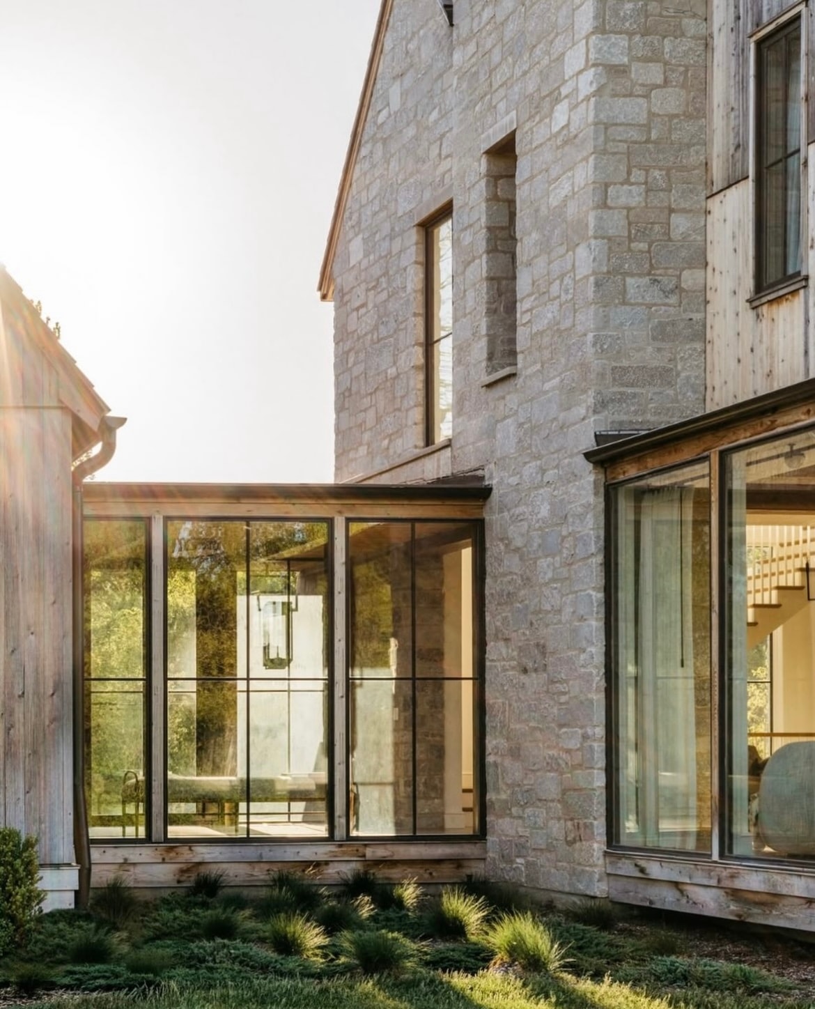 Modern stone house with glass extension